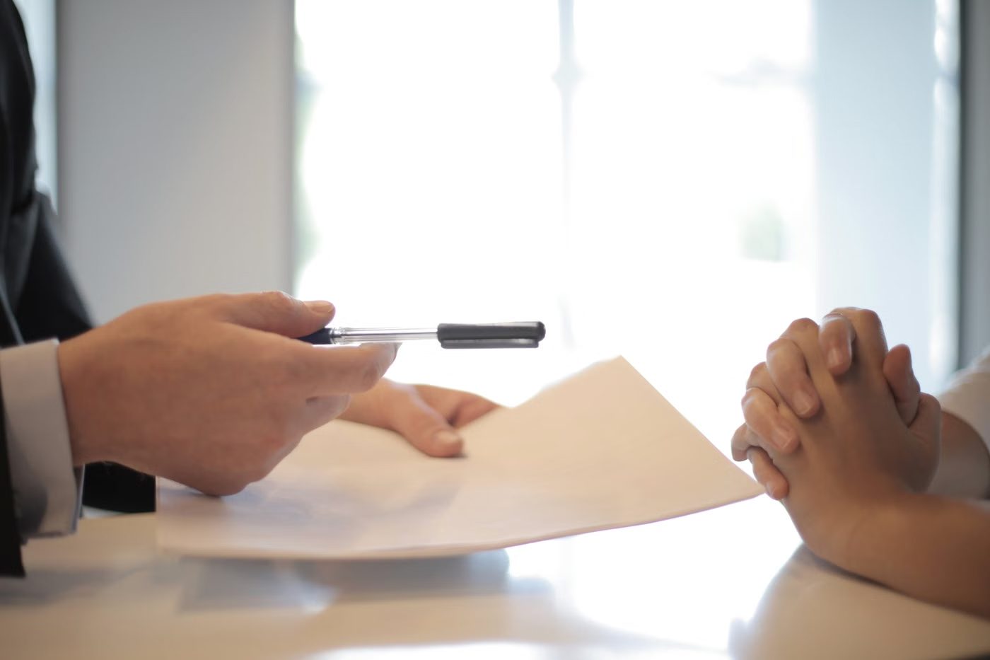 Advisers reviewing documents across a table